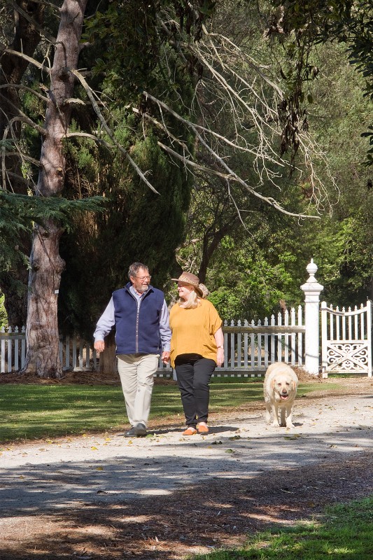 Andy and Annie walking the grounds of their home